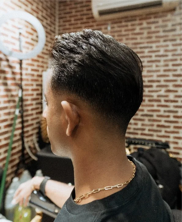 Skullfade barber performing a skin fade and line-up in NYC's Financial District
