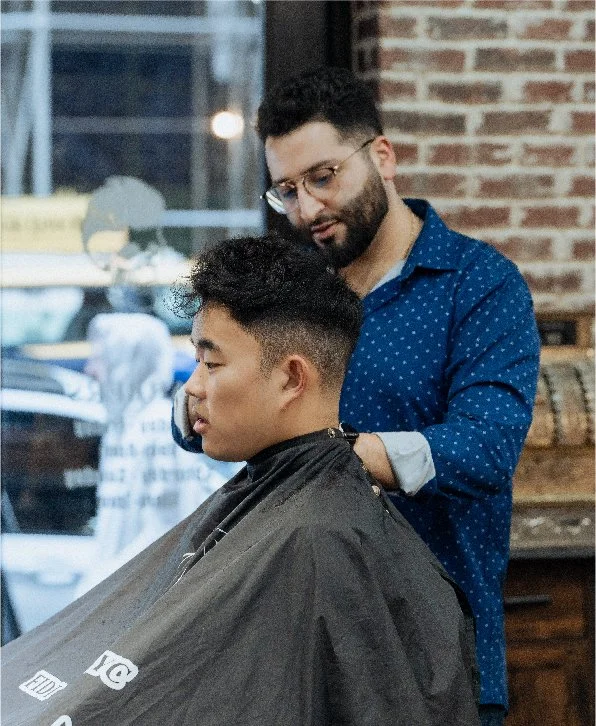 Skullfade barber performing a skin fade and line-up in NYC's Financial District
